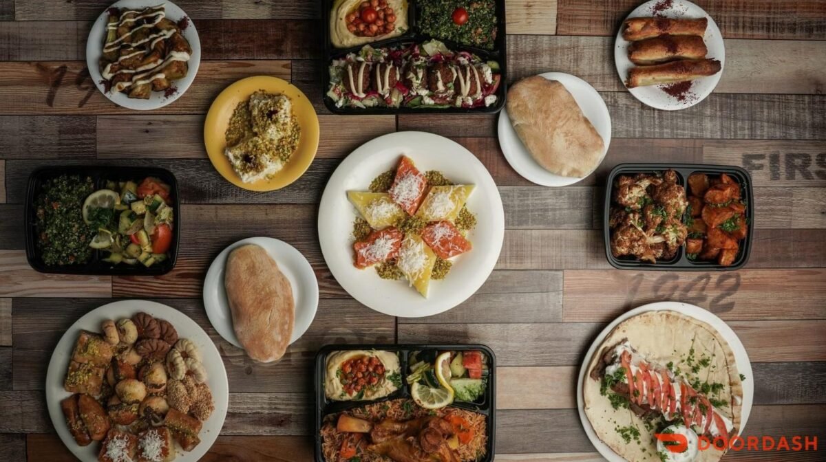 Mediterranean catering spread with mezze, salads, plates and desserts