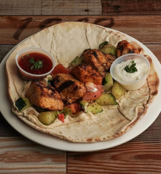 Chicken kabab wrap on pita with garlic sauce and salad