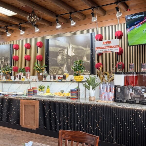 Dessert counter and fresh juice dispensers inside the restaurant