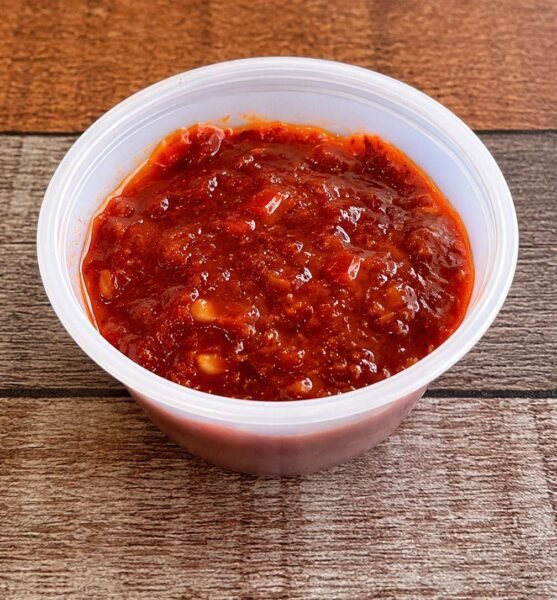 House spicy sauce in a 2 oz cup